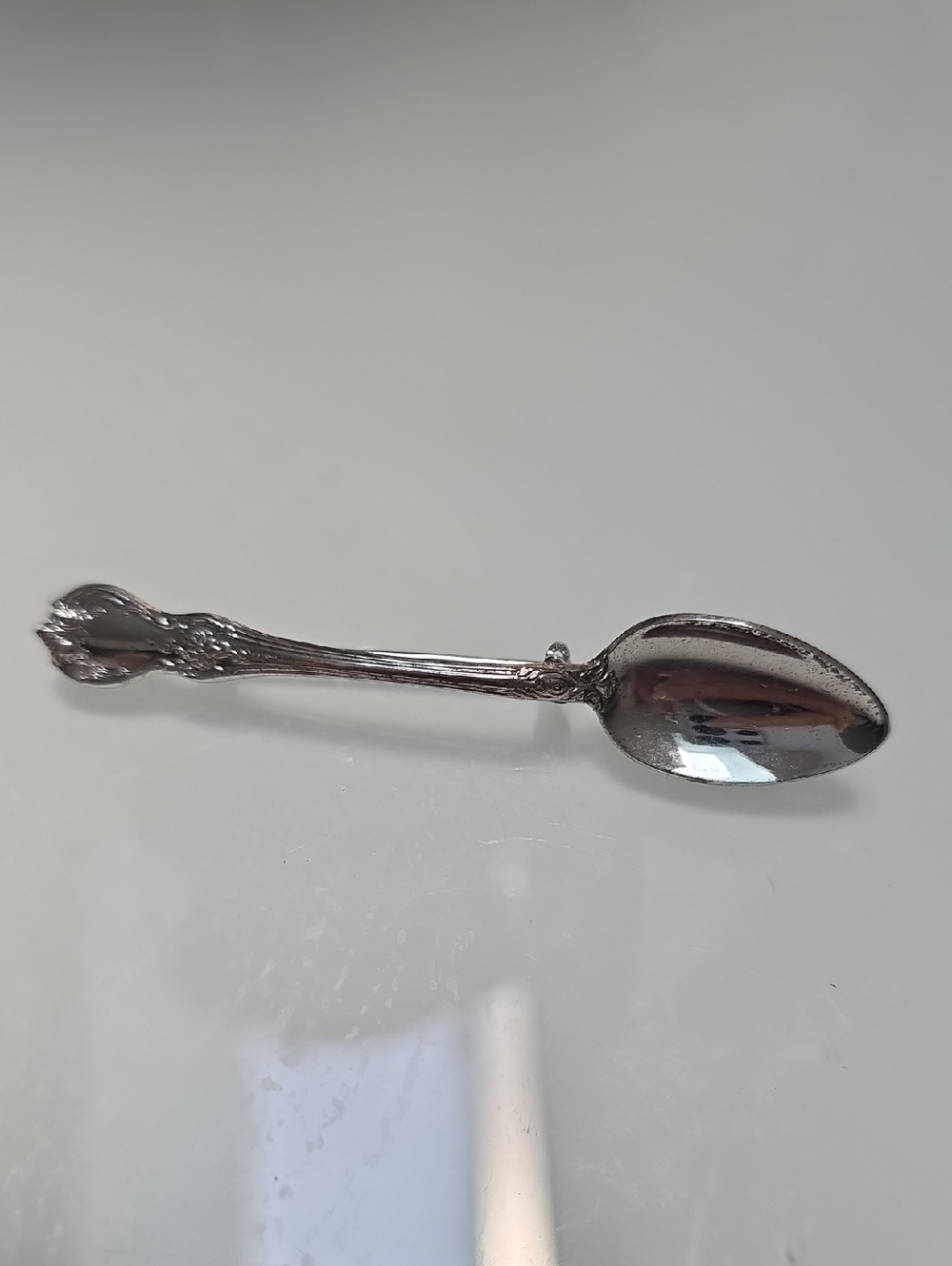 Ornate Silver-Tone Decorative Spoon